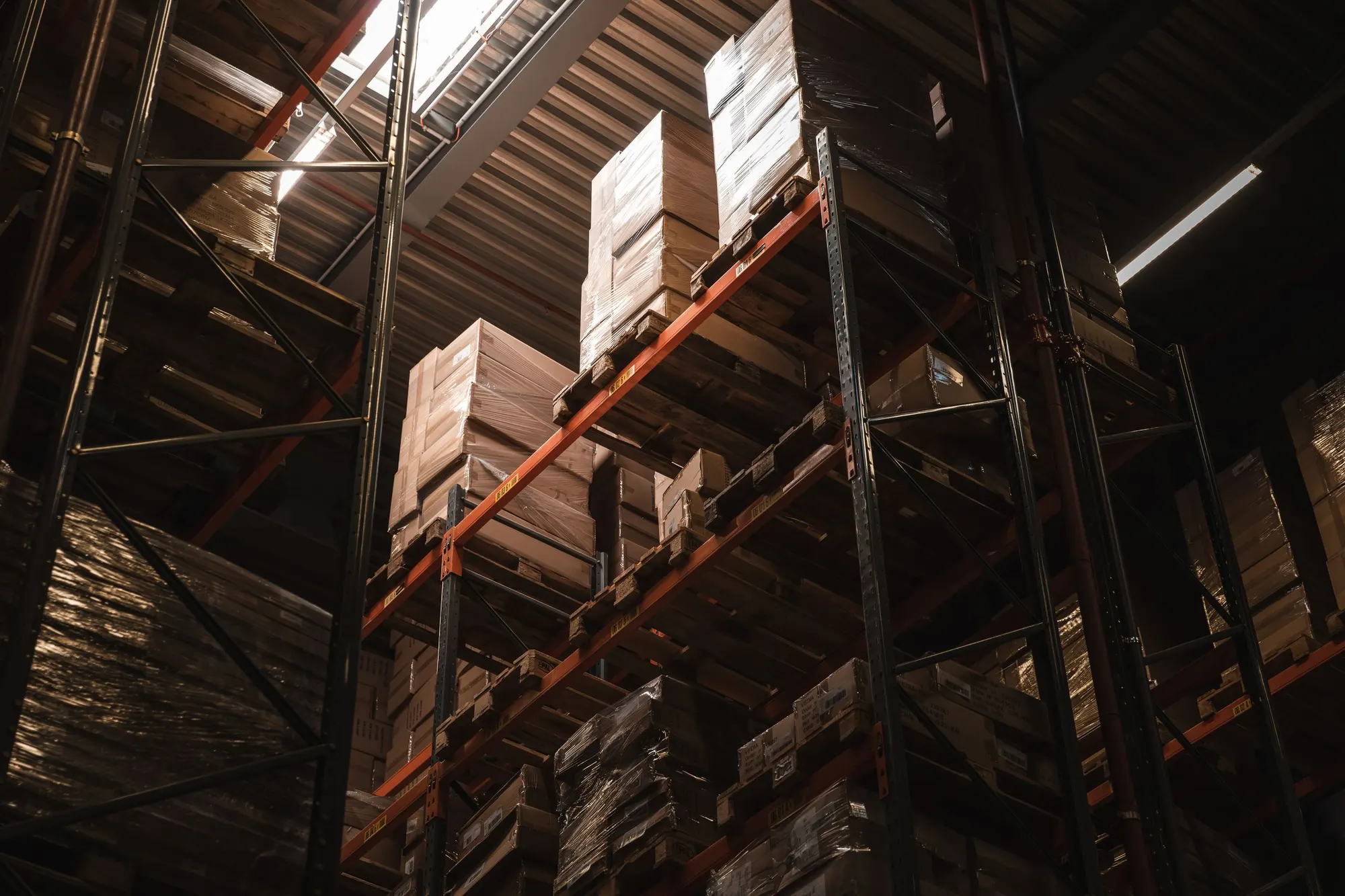 Tall warehouse racking stacked with boxed stock